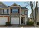 Front view of townhome, showcasing stone and siding at 962 Pierce Ivy Ct, Lawrenceville, GA 30043