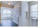 Hallway with tile flooring and access to rooms at 962 Pierce Ivy Ct, Lawrenceville, GA 30043