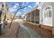 Brick house with screened porch and a stone walkway, pine straw ground cover at 1772 Benningfield Dr, Marietta, GA 30064