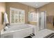 Bathroom with soaking tub and walk-in shower, plus a window at 1772 Benningfield Dr, Marietta, GA 30064