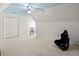 Large bedroom with light blue ceiling, ceiling fan and rocking chair at 1772 Benningfield Dr, Marietta, GA 30064