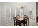 Bright dining area with table and chairs, plus plantation shutters at 1772 Benningfield Dr, Marietta, GA 30064