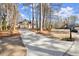 Long driveway leading to a brick house in a wooded area at 1772 Benningfield Dr, Marietta, GA 30064