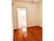 Finished basement room with hardwood floors and doorway at 4817 Carlene Sw Way, Lilburn, GA 30047