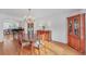 Formal dining room featuring hardwood floors and a lovely chandelier at 4817 Carlene Sw Way, Lilburn, GA 30047