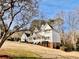 Two-story house with a wraparound porch and large backyard at 4817 Carlene Sw Way, Lilburn, GA 30047