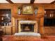 Brick fireplace with built-in wooden shelving and mantle at 4817 Carlene Sw Way, Lilburn, GA 30047