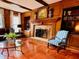 Living room with hardwood floors, fireplace, and built-in bookcases at 4817 Carlene Sw Way, Lilburn, GA 30047