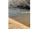 Calm river with a sandy bank and clear water at 4817 Carlene Sw Way, Lilburn, GA 30047