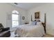 Bedroom with a queen-size bed and large window at 1965 Tiner Ct, Cumming, GA 30041