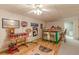Finished basement bar with wood floors, barstool seating, and storage space at 3639 Fowler Rdg, Douglasville, GA 30135