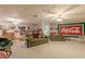 Finished basement rec room with bar and large Coca-Cola mural at 3639 Fowler Rdg, Douglasville, GA 30135