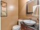 Charming powder room with stylish sink, dark granite counters, and warm paint at 3639 Fowler Rdg, Douglasville, GA 30135