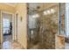 Large walk-in shower with glass enclosure and neutral tile at 3639 Fowler Rdg, Douglasville, GA 30135