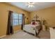 Charming bedroom with a white four-poster bed and neutral decor at 3639 Fowler Rdg, Douglasville, GA 30135