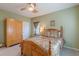 Cozy bedroom with wooden bed frame, neutral walls, carpet, and ceiling fan at 3639 Fowler Rdg, Douglasville, GA 30135