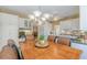 Dining area featuring wood table with seating for six, cabinetry, and decor at 3639 Fowler Rdg, Douglasville, GA 30135