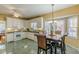 Open concept kitchen and breakfast nook with white cabinets and stainless steel appliances at 3639 Fowler Rdg, Douglasville, GA 30135