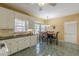 Bright kitchen with white cabinets, dark countertops, and a cozy breakfast nook at 3639 Fowler Rdg, Douglasville, GA 30135