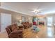 Cozy living room with stone fireplace, ceiling fan, hardwood floors, and comfortable seating at 3639 Fowler Rdg, Douglasville, GA 30135