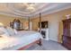 Spacious bedroom with a four-poster bed, ceiling fan, fireplace, and large windows at 3639 Fowler Rdg, Douglasville, GA 30135