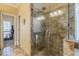 Nicely tiled shower stall featuring glass door and walls and a rain shower head at 3639 Fowler Rdg, Douglasville, GA 30135
