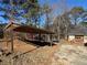 Wooden carport structure with ample storage at 144 Rockbridge Sw Rd, Lilburn, GA 30047