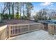 Large backyard with new deck, sloping terrain, and mature trees at 2933 Edna Ln, Decatur, GA 30032