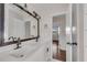 Stylish bathroom with double vanity, black fixtures and view to bedroom at 2933 Edna Ln, Decatur, GA 30032