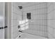 Updated bathroom with white subway tile shower and black accents at 2933 Edna Ln, Decatur, GA 30032