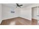 Well-lit bedroom featuring hardwood floors and a ceiling fan at 2933 Edna Ln, Decatur, GA 30032