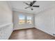 Well-lit bedroom with hardwood floors, ceiling fan and two large windows at 2933 Edna Ln, Decatur, GA 30032