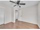 Hardwood floor bedroom with ceiling fan and access to hallway at 2933 Edna Ln, Decatur, GA 30032