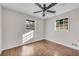 Spacious bedroom with hardwood floors and ceiling fan at 2933 Edna Ln, Decatur, GA 30032