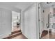 Clean hallway with white brick feature wall and hardwood floors at 2933 Edna Ln, Decatur, GA 30032