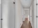 Long hallway with hardwood floors and neutral-colored walls at 2933 Edna Ln, Decatur, GA 30032