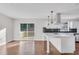 Modern kitchen with white cabinets, quartz countertops, and island at 2933 Edna Ln, Decatur, GA 30032