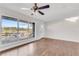 Spacious living room with hardwood floors and large windows at 2933 Edna Ln, Decatur, GA 30032