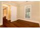 Well-lit bedroom with hardwood floors and access to another room at 318 Liberty Ln, Canton, GA 30114