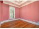 Bright bedroom with hardwood floors and pink walls at 318 Liberty Ln, Canton, GA 30114