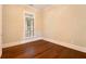 Bright bedroom with hardwood floors and large window at 318 Liberty Ln, Canton, GA 30114