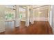 Spacious dining room with hardwood floors and views into the kitchen area at 318 Liberty Ln, Canton, GA 30114