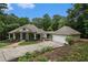 House exterior, large green home with attached garage and landscaped lawn at 318 Liberty Ln, Canton, GA 30114