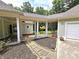 Landscaped front yard with walkway to garage at 318 Liberty Ln, Canton, GA 30114