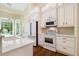 Modern kitchen with white cabinets and quartz countertops at 318 Liberty Ln, Canton, GA 30114