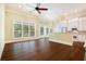 Kitchen with white cabinets, hardwood floors, and a breakfast bar at 318 Liberty Ln, Canton, GA 30114