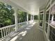 Spacious porch overlooking a wooded area at 318 Liberty Ln, Canton, GA 30114