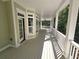 Spacious porch with white columns and wooded views at 318 Liberty Ln, Canton, GA 30114