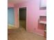 Unfinished basement with pink and blue walls at 5234 Maroney Mill Rd, Douglasville, GA 30134