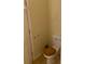 Small half bathroom with a toilet and wood-toned seat at 5234 Maroney Mill Rd, Douglasville, GA 30134